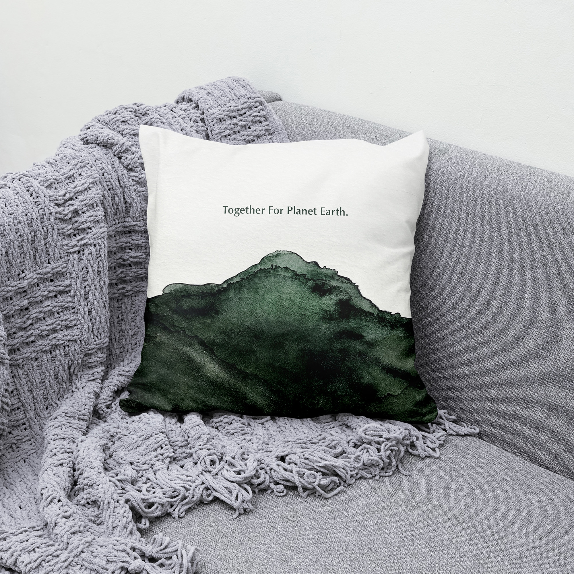 OF NATURE landscape artwork on a decorative pillow