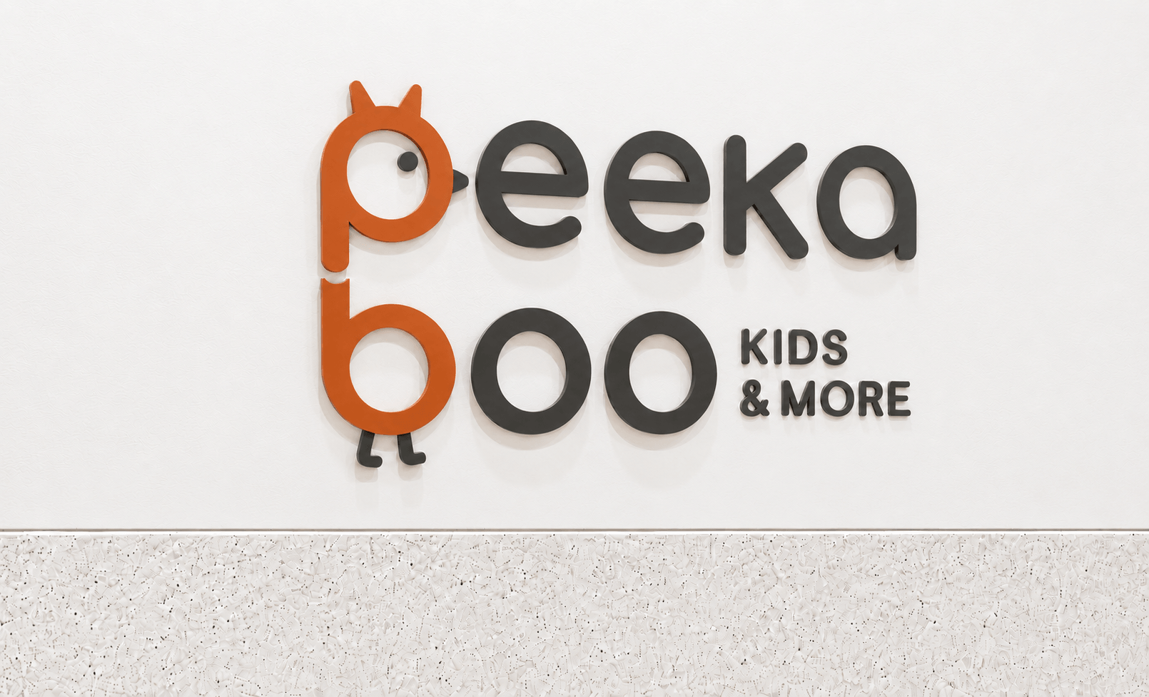 Peekaboo dimensional wall sign above the terrazzo counter