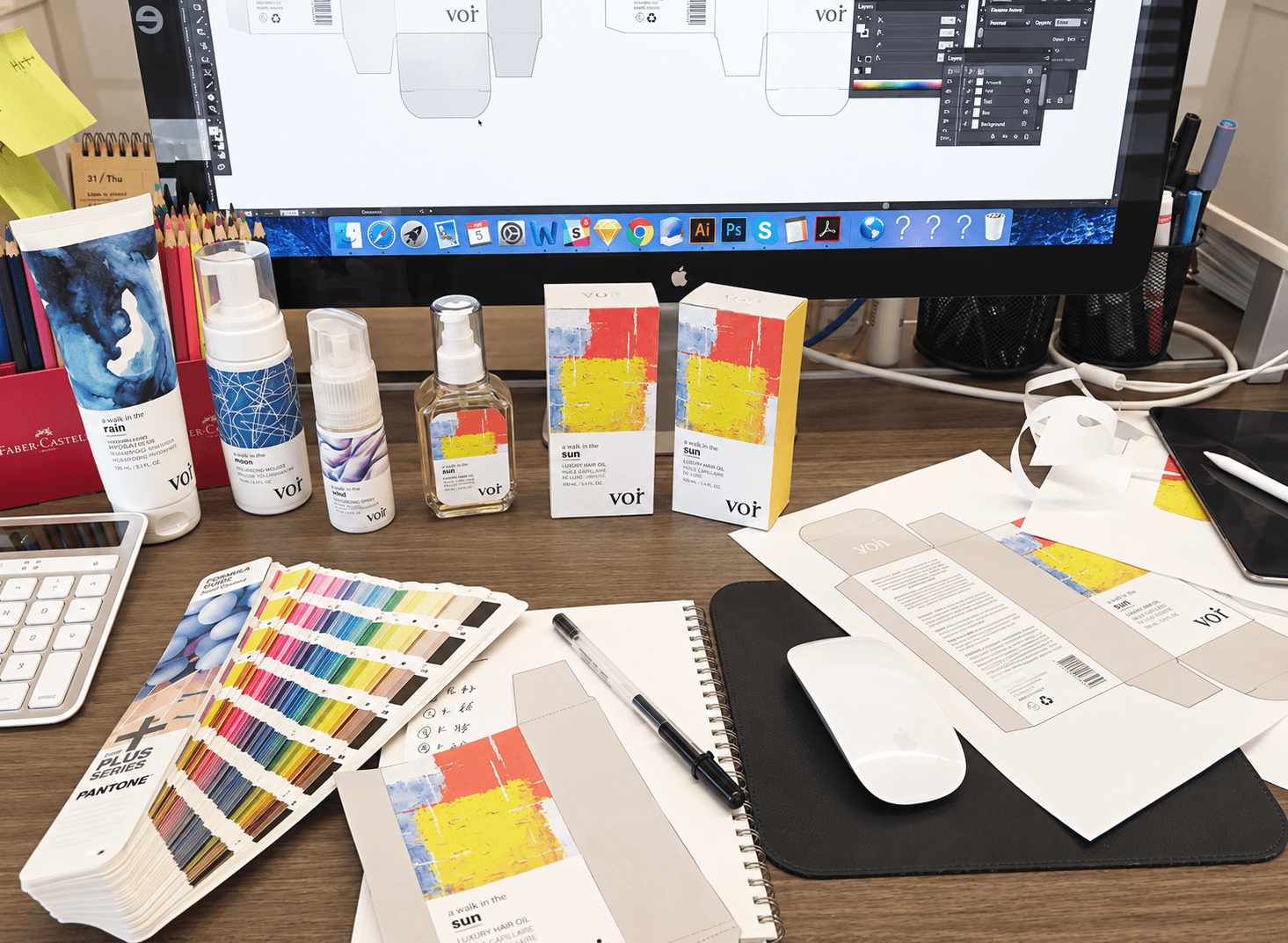 VOIR packaging design workspace with prototypes, colour swatches, and printed labels