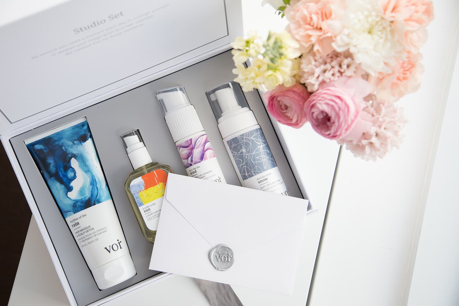 VOIR Studio Set gift box with haircare products and flowers